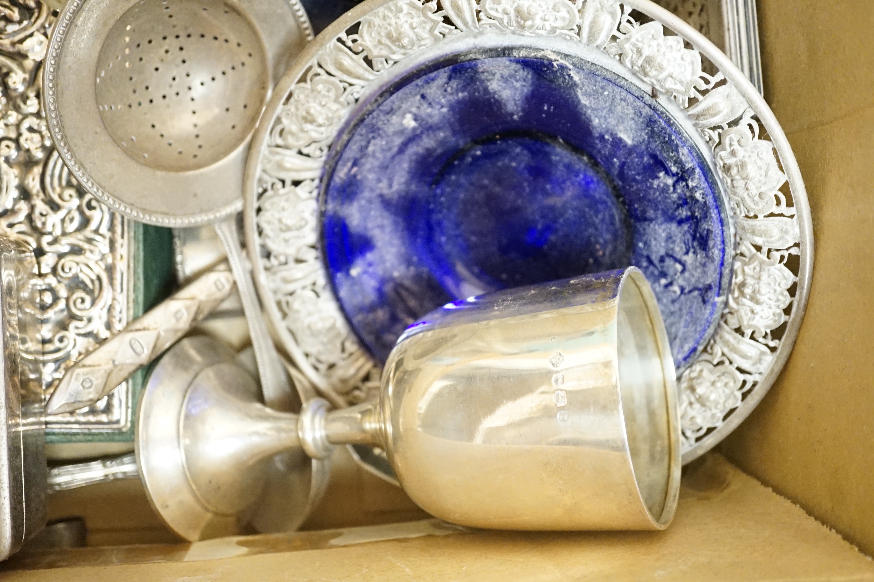 Sundry silver including a boxed set of eight Cartier sterling condiments 37mm, cigarette box, goblet, dish with blue glass liner, bowl, tumbler cup, flatware, mounted glass oil and vinegar bottle, etc.